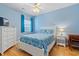 Comfortable bedroom with a ceiling fan, white furniture, blue accents, and hardwood floors at 4503 W Harbour Ct. # S-12, Little River, SC 29566