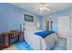 Bright bedroom with white bed frame, blue accents, ceiling fan and cozy furnishings at 4503 W Harbour Ct. # S-12, Little River, SC 29566