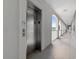 Building elevator provides convenient access to upper floors, enhancing accessibility for residents at 4503 W Harbour Ct. # S-12, Little River, SC 29566