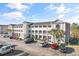 Exterior view of the condo building, showing the facade and parking area in front at 4503 W Harbour Ct. # S-12, Little River, SC 29566