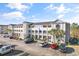 Exterior view of the condo building, showing the facade and parking area in front at 4503 W Harbour Ct. # S-12, Little River, SC 29566