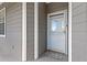 Inviting front door features a welcome mat and neutral siding, creating a warm entrance at 4503 W Harbour Ct. # S-12, Little River, SC 29566