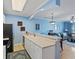 Open kitchen with white cabinets and view of the living room at 4503 W Harbour Ct. # S-12, Little River, SC 29566