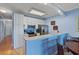 Well-lit kitchen with white cabinetry, stainless steel appliances, and a breakfast bar at 4503 W Harbour Ct. # S-12, Little River, SC 29566