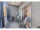 Cozy outdoor patio with seating, ceiling fan, and sliding glass doors at 4503 W Harbour Ct. # S-12, Little River, SC 29566