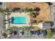 Aerial view of community pool surrounded by palm trees and parking for easy access at 4503 W Harbour Ct. # S-12, Little River, SC 29566