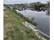 Water view overlooking a tranquil canal with docks, marsh vegetation, and neighborhood homes at 4503 W Harbour Ct. # S-12, Little River, SC 29566