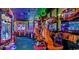 Vibrant and colorful arcade room for Gathering entertainment, featuring various arcade games at 4800 S Ocean Blvd. # 1418, North Myrtle Beach, SC 29582