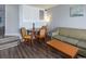 Cozy living area featuring a dining table, comfortable sofa, and stylish decor, perfect for relaxation at 4800 S Ocean Blvd. # 1418, North Myrtle Beach, SC 29582