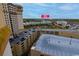 View of condo parking garage looking out over other buildings and green space at 4800 S Ocean Blvd. # 1418, North Myrtle Beach, SC 29582