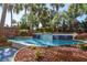 Relaxing pool area surrounded by lush tropical landscaping with dolphin accents at 4800 S Ocean Blvd. # 1418, North Myrtle Beach, SC 29582