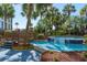 Beautiful water feature with dolphin tile accents amidst lush landscaping and palm trees at 4800 S Ocean Blvd. # 1418, North Myrtle Beach, SC 29582