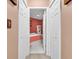 Bathroom entryway featuring white paneled doors with a view into the bathroom at 4814 Innisbrook Ct. # 412, Myrtle Beach, SC 29579