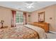 Comfortable bedroom featuring a large bed, ceiling fan, and ample natural light at 4814 Innisbrook Ct. # 412, Myrtle Beach, SC 29579