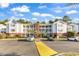 Well-maintained condos with white siding, balconies, brick accents, and ample parking spaces at 4814 Innisbrook Ct. # 412, Myrtle Beach, SC 29579