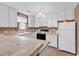 Well-lit kitchen with white appliances, tile floors and spacious countertops at 4814 Innisbrook Ct. # 412, Myrtle Beach, SC 29579
