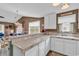 Open kitchen with counter seating and view into the living area, great for entertaining at 4814 Innisbrook Ct. # 412, Myrtle Beach, SC 29579