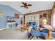 A living room with blue couches, a television, an area rug, and access to a porch at 4814 Innisbrook Ct. # 412, Myrtle Beach, SC 29579