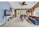 A living room showcasing the couch, rug, ceiling fan, and access to the porch at 4814 Innisbrook Ct. # 412, Myrtle Beach, SC 29579