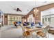 An open-concept living space with a dining table and access to an outdoor patio at 4814 Innisbrook Ct. # 412, Myrtle Beach, SC 29579