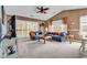 A living room with blue couches and access to the porch from the sliding glass door at 4814 Innisbrook Ct. # 412, Myrtle Beach, SC 29579