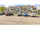 Charming townhome exterior with well-maintained landscaping and ample parking at 500 Fairway Village Dr. # 7-D, Myrtle Beach, SC 29588