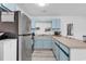 Charming kitchen with stainless steel refrigerator and updated cabinets and appliances at 500 Fairway Village Dr. # 7-D, Myrtle Beach, SC 29588
