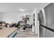 Bright kitchen featuring stainless steel refrigerator, breakfast bar, and hardwood floors at 500 Fairway Village Dr. # 7-D, Myrtle Beach, SC 29588