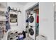 Laundry room with stacked washer and dryer, shelving for storage, and lots of light at 500 Fairway Village Dr. # 7-D, Myrtle Beach, SC 29588