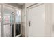 Hallway view of condo entrance showing a white door and view of the elevator at 504 N Ocean Blvd. # 401, Myrtle Beach, SC 29577