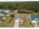 Aerial shot of home backing up to a large pond and wooded area at 511 Mattamushkeet Dr., Little River, SC 29566