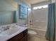 Clean bathroom features a sink, toilet, and bath tub with shower head at 511 Mattamushkeet Dr., Little River, SC 29566