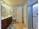 Bright bathroom features a double sink vanity with dark wood cabinets and a tiled floor at 511 Mattamushkeet Dr., Little River, SC 29566