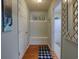 Inviting entryway features storage with a custom bench, coat hooks, and decor at 511 Mattamushkeet Dr., Little River, SC 29566