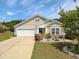 Charming home featuring a 1-car garage and meticulously landscaped front yard at 511 Mattamushkeet Dr., Little River, SC 29566