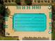 Aerial view of a community pool with swimmers, surrounded by lounge chairs and manicured landscaping at 511 Mattamushkeet Dr., Little River, SC 29566