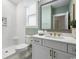 Clean bathroom with a step-in shower, white vanity, and mint green walls at 512 9Th Ave. S, North Myrtle Beach, SC 29582