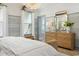 Bright bedroom featuring a serene color palette, wood floors, and stylish light fixture at 512 9Th Ave. S, North Myrtle Beach, SC 29582