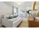 Charming bedroom with white shiplap, wood floors, and modern decor at 512 9Th Ave. S, North Myrtle Beach, SC 29582