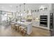 Beautiful kitchen with white cabinets, a center island with seating, stainless appliances, and pendant lighting at 512 9Th Ave. S, North Myrtle Beach, SC 29582
