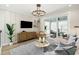 Cozy living room with stylish furnishings, a flat-screen TV, modern decor, and sliding glass doors at 512 9Th Ave. S, North Myrtle Beach, SC 29582