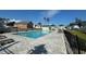Community pool with lounge chairs and cabana surrounded by lush greenery at 512 9Th Ave. S, North Myrtle Beach, SC 29582