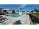 Community pool surrounded by stone pavers and lounge chairs, perfect for relaxation and recreation at 512 9Th Ave. S, North Myrtle Beach, SC 29582