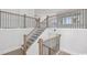 Elegant staircase with wood and black iron railings, leading to the upper level at 512 9Th Ave. S, North Myrtle Beach, SC 29582