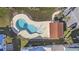 Aerial view of a community pool surrounded by colorful homes at 514 Vallecrosia Ct., Little River, SC 29566