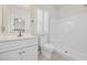 All-white bathroom featuring tiled floors, vanity and a walk-in shower at 514 Vallecrosia Ct., Little River, SC 29566