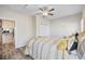 Bedroom featuring neutral tones, a ceiling fan, and natural light from the windows at 514 Vallecrosia Ct., Little River, SC 29566