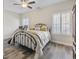Comfortable bedroom with large windows, shutters, and warm decor at 514 Vallecrosia Ct., Little River, SC 29566