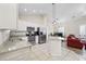 Bright kitchen featuring white cabinetry, granite countertops, and stainless appliances at 514 Vallecrosia Ct., Little River, SC 29566