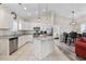 Bright kitchen featuring white cabinetry, granite countertops, and stainless appliances at 514 Vallecrosia Ct., Little River, SC 29566